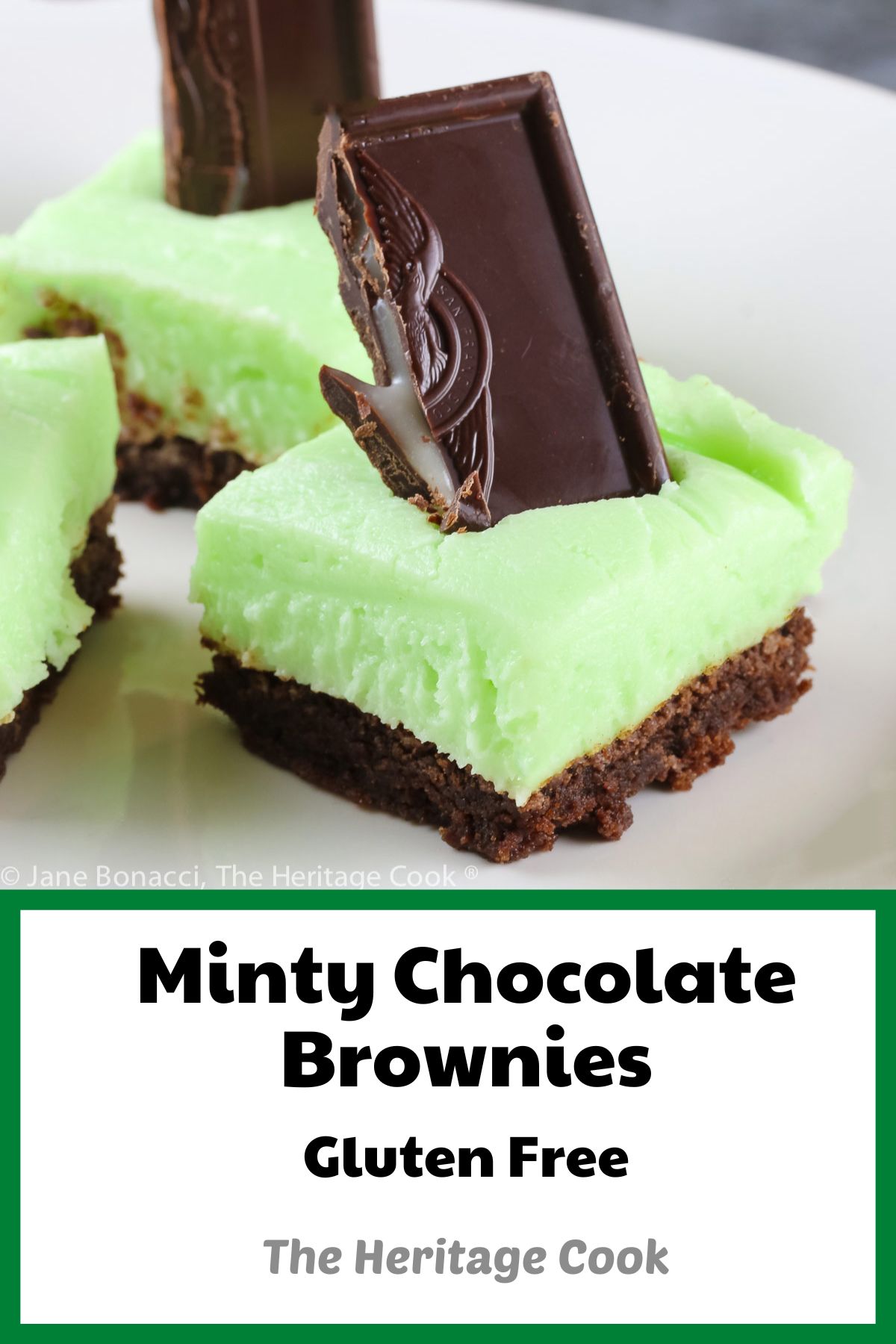Brownies topped with pale green frosting with a chocolate-covered mint candy stuck in the top; Minty Chocolate Brownies © 2022 Jane Bonacci, The Heritage Cook. 
