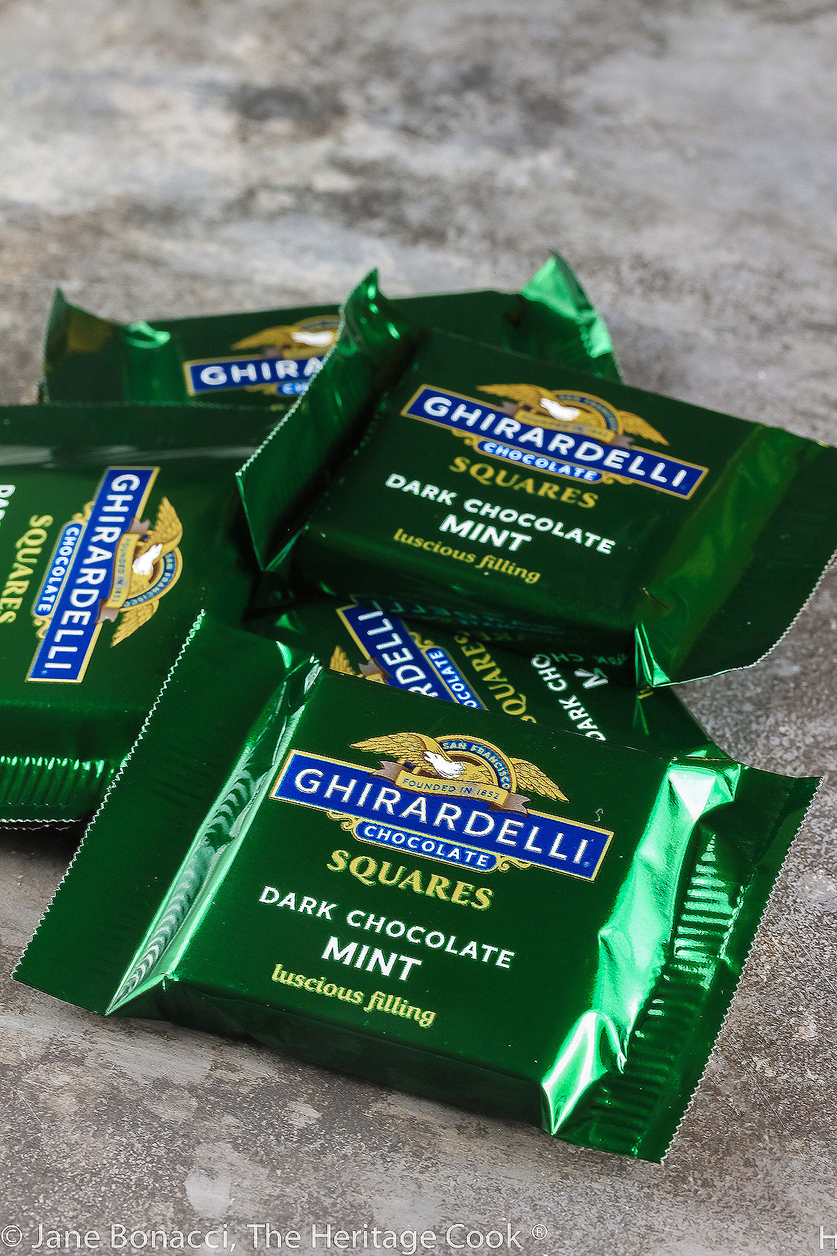 Pile of wrapped Ghirardelli Chocolate Mint Squares. 