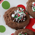 Small cookie cups filled with mint chocolate ganache and topped with festive holiday sprinkles; Hot Chocolate Mint Thumbprint Cookies © 2022 Jane Bonacci, The Heritage Cook.