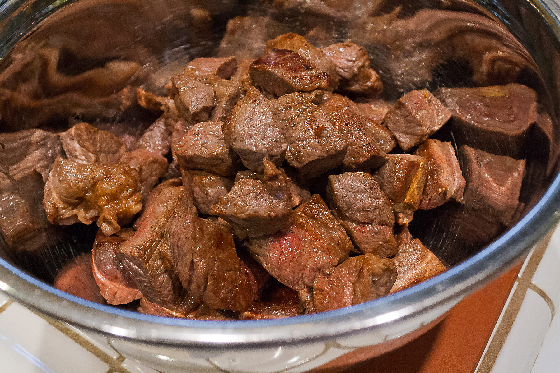 Chopped and dried beef chunks in bowl. 