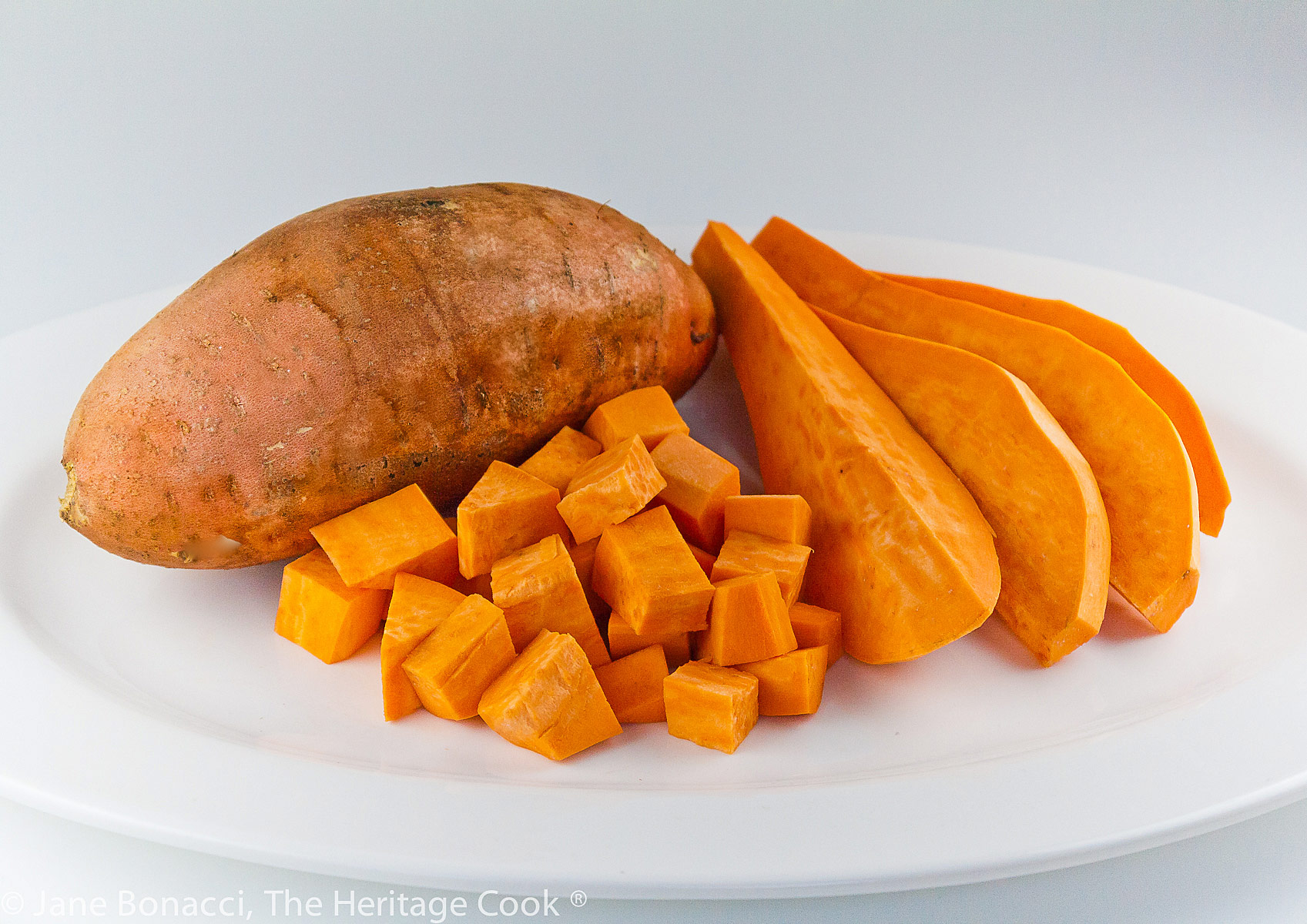 Sweet potato preparation; whole, sliced, and cubed. 