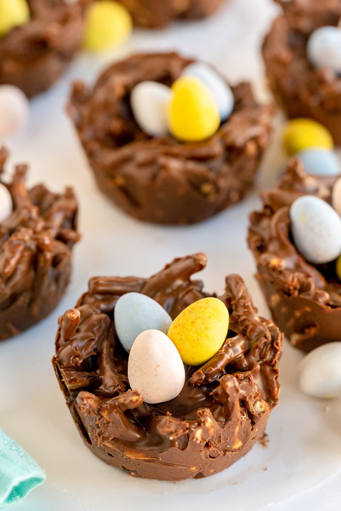 Chocolate nests with bright Easter candies inside; 21 different chocolate treats in this blog post round-up are swoon-worthy; 21 Chocolate Easter Treats round-up 2023; assembled by Jane Bonacci, The Heritage Cook. 