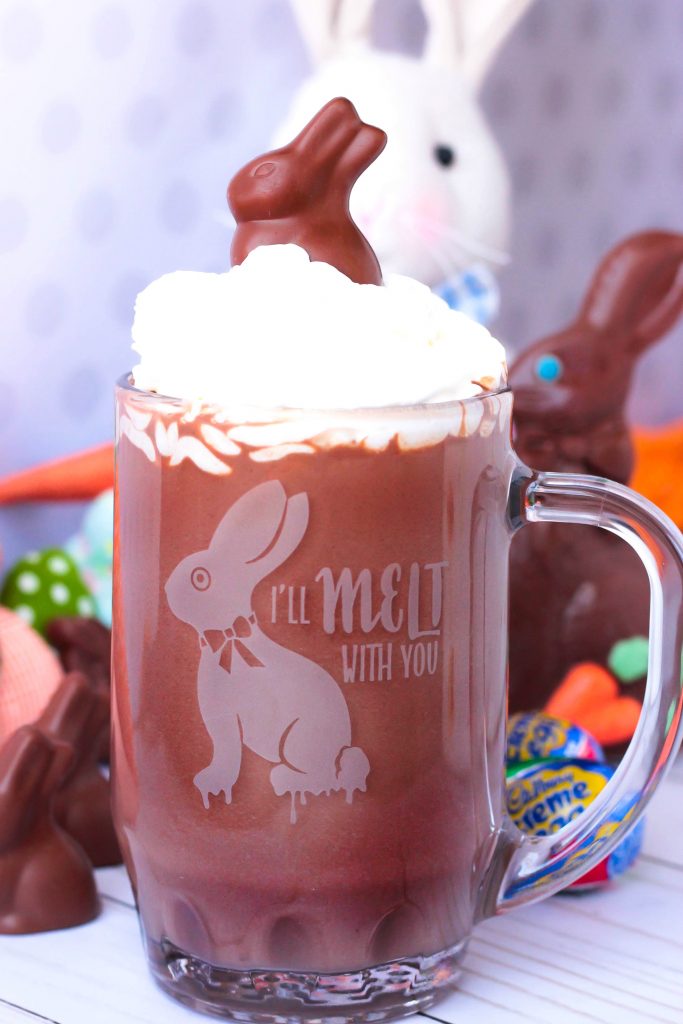 Glass mug of hot chocolate with whipped cream on top; 21 different chocolate treats in this blog post round-up are swoon-worthy; 21 Chocolate Easter Treats round-up 2023; assembled by Jane Bonacci, The Heritage Cook. 