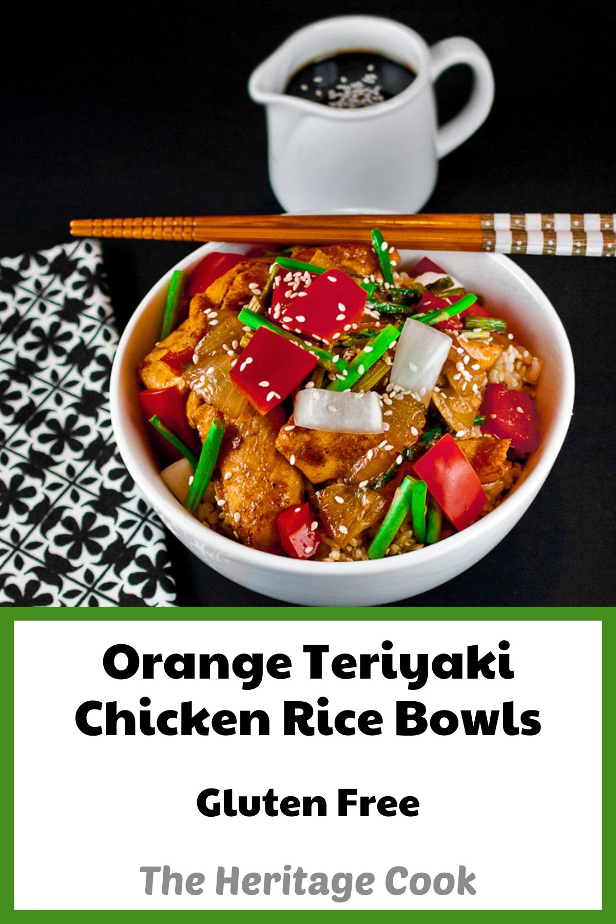 Rice bowls topped with teriyaki coated chicken pieces with red bell peppers, onions, asparagus, and sesame seeds; Orange Teriyaki Chicken Bowls © 2023 Jane Bonacci, The Heritage Cook. 