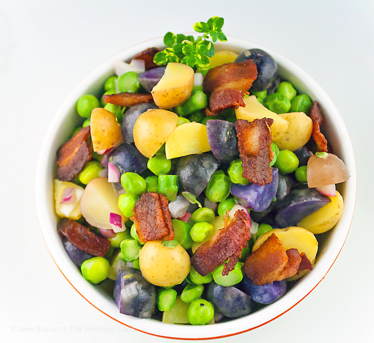 Potato Salad with Spring Vegetables, bacon and Lemon Vinaigrette; Collection of 25 Amazing BBQ Side Dishes from around the Web; compiled by Jane Bonacci, The Heritage Cook 2023. 