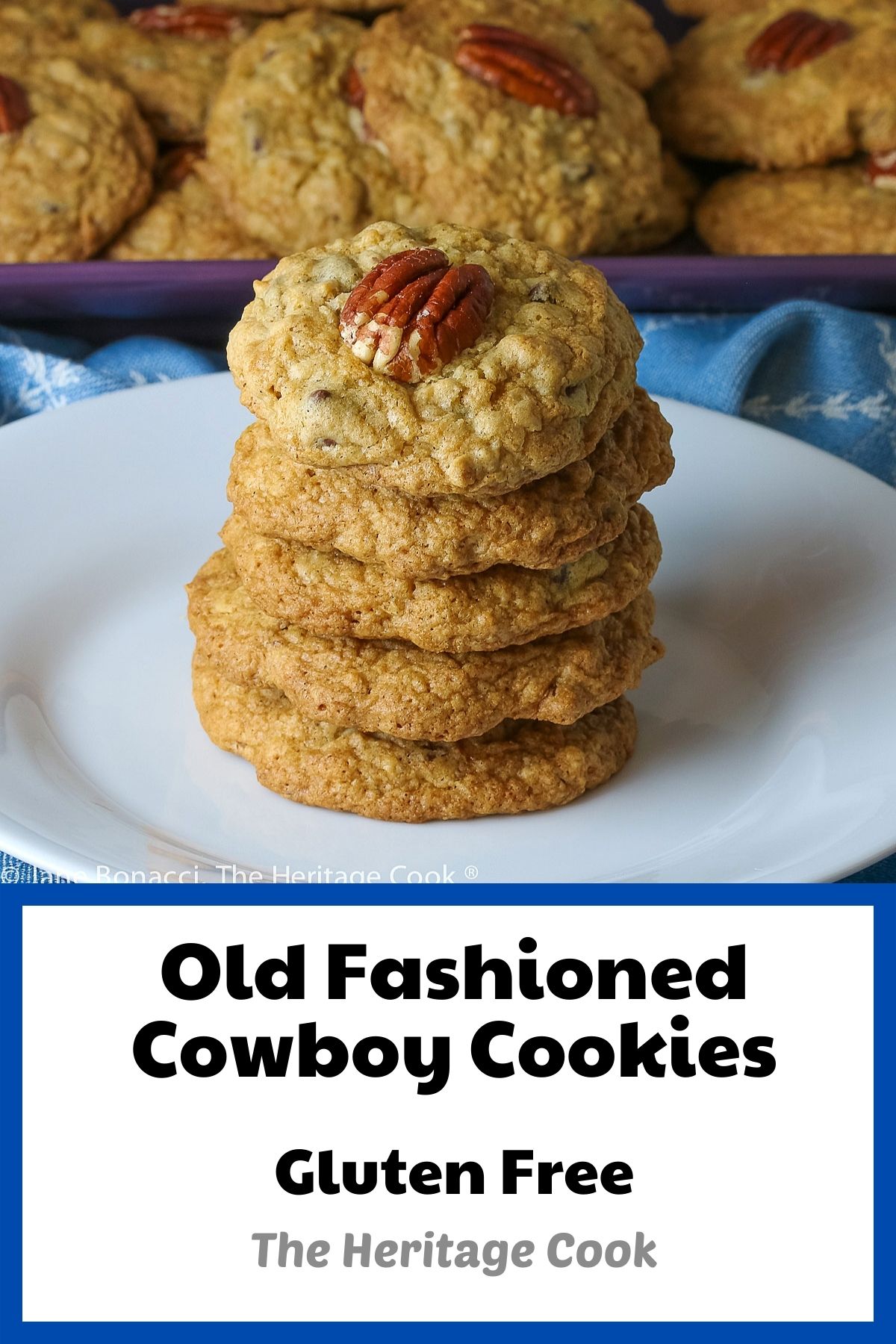 Pile of Old Fashioned Cowboy Cookies on purple platter on top of a blue napkin; some cookies stacked, the top one with a pecan on top © 2023 Jane Bonacci, The Heritage Cook. 