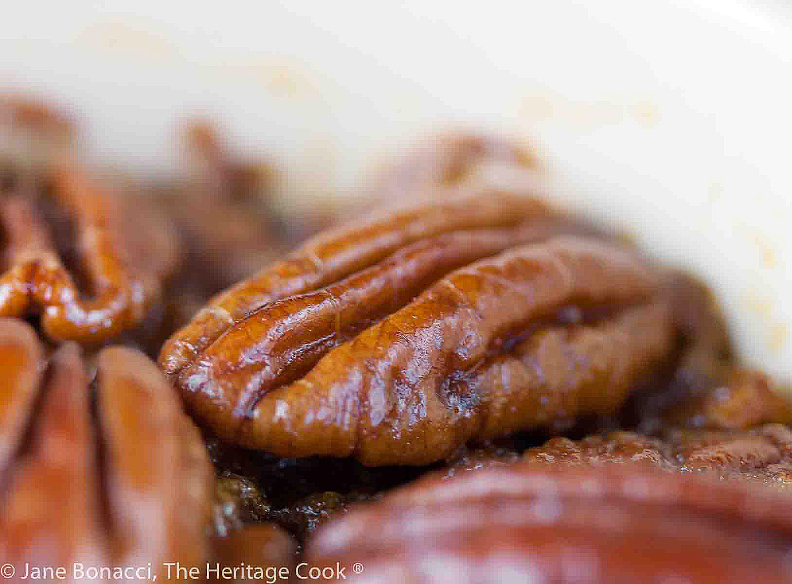 Close up of a pile of pecan halves. 