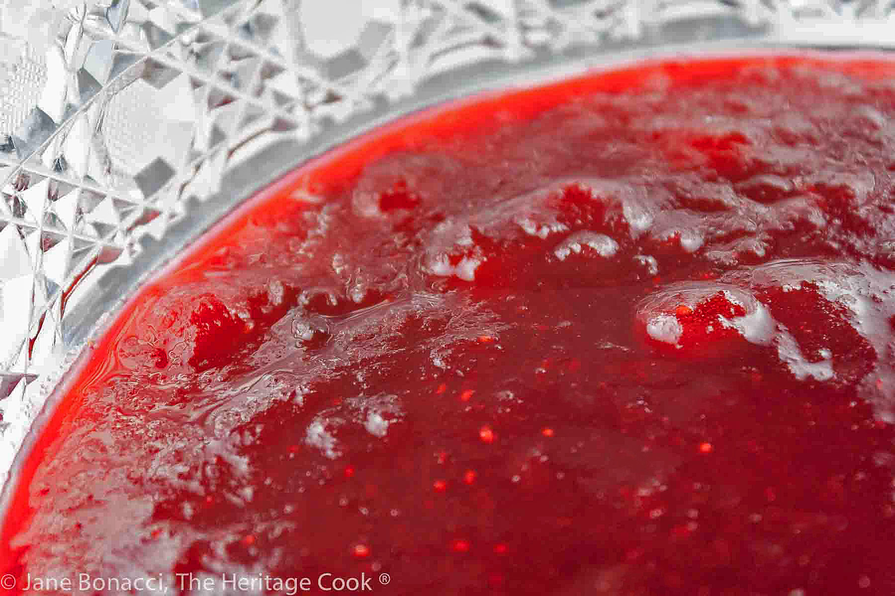 Close up of cranberry sauce in cut glass bowl. 