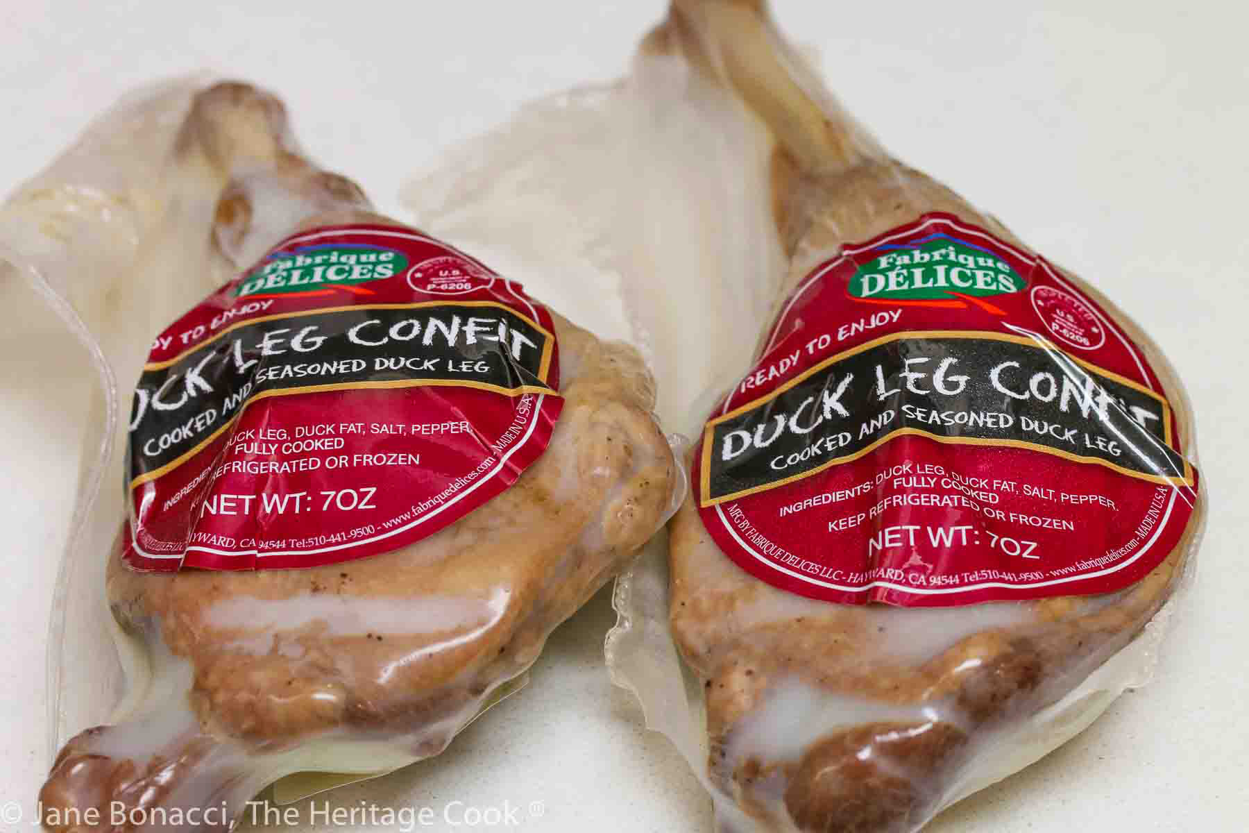 two packaged confit duck legs ready for the soup. 