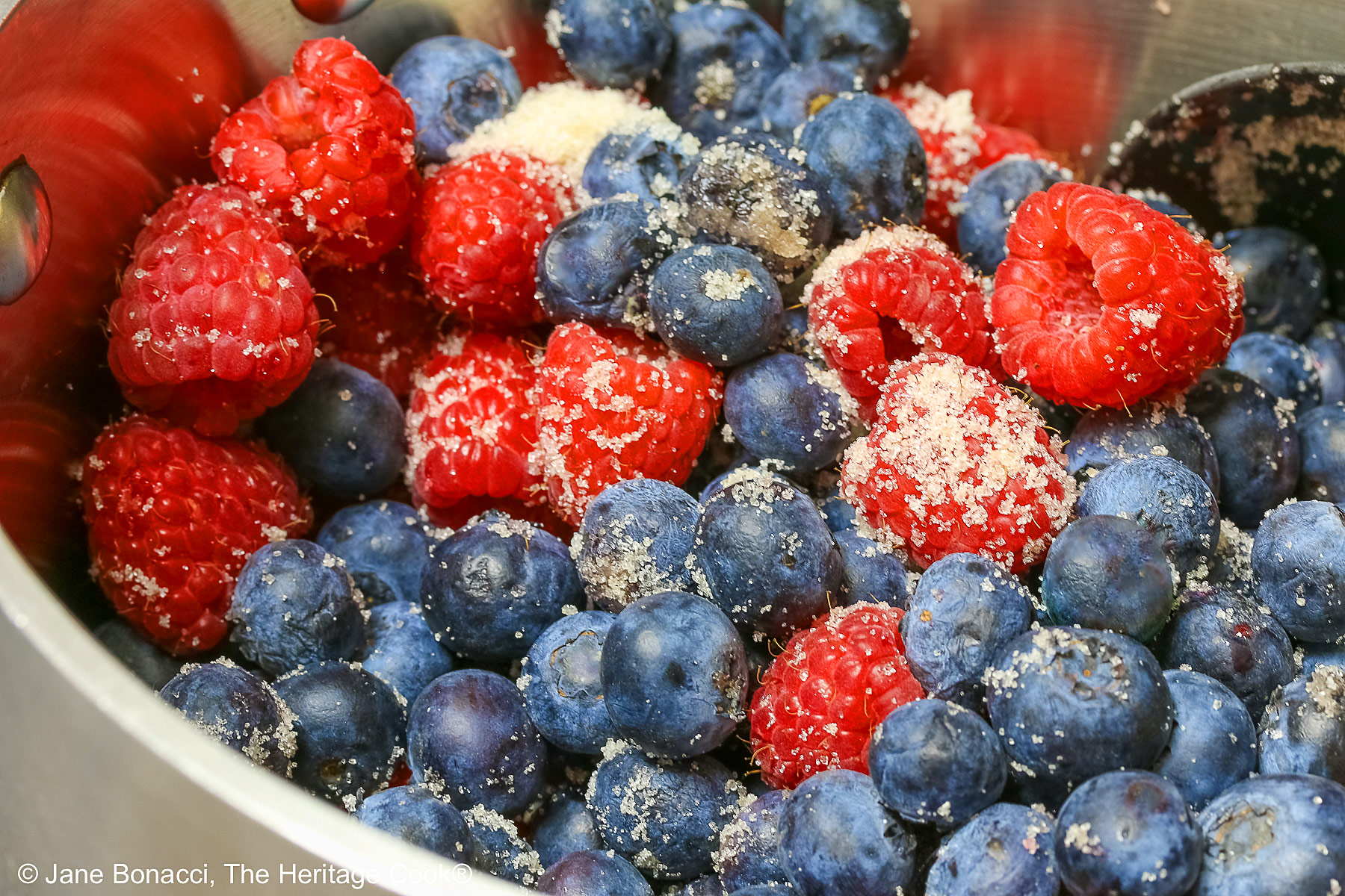Blueberries and raspberries tossed with sugar. 