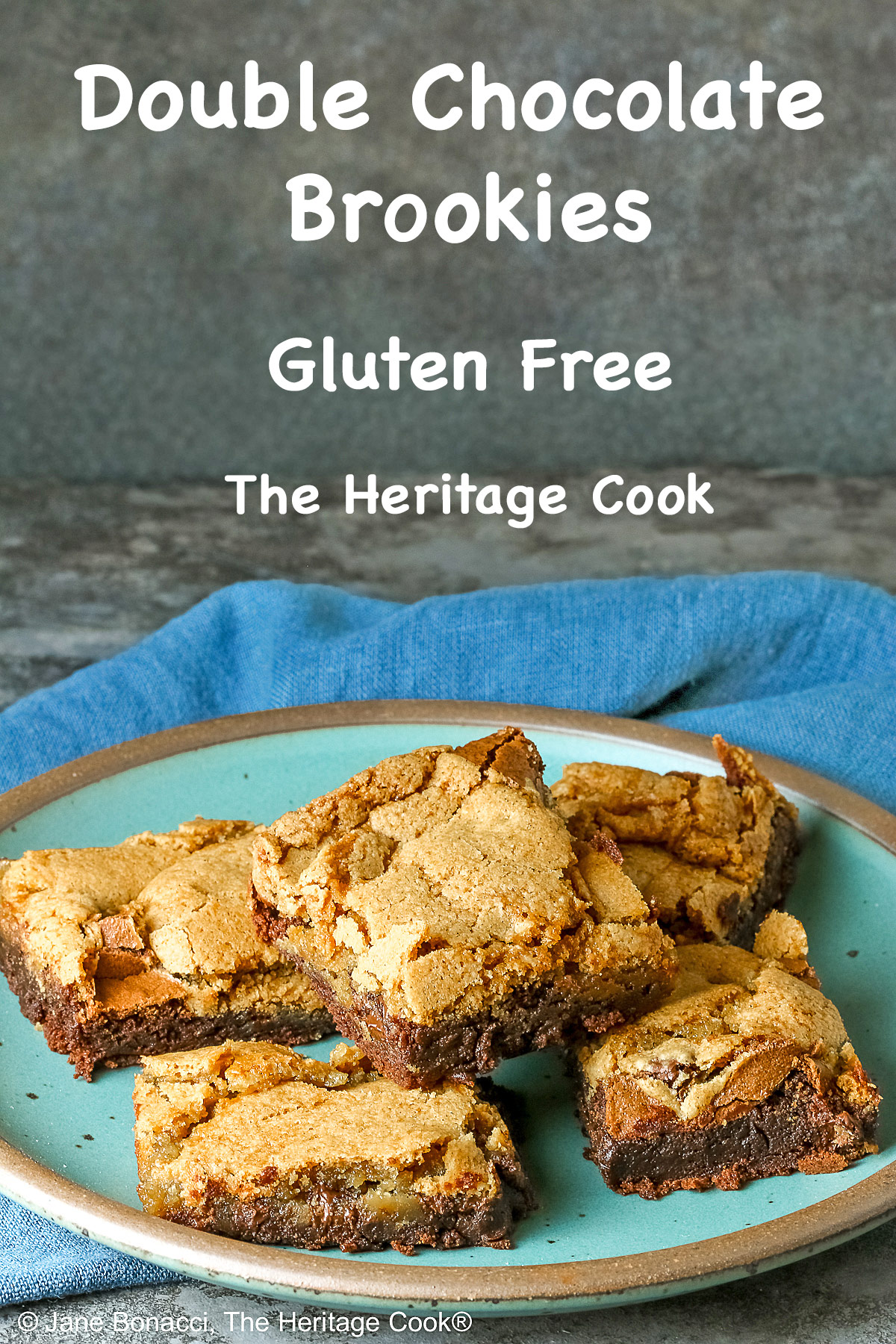 5 stacked Double Chocolate Brookies sitting on a turquoise colored plate with a medium blue cloth behind, on a mottled gray background © 2025 Jane Bonacci, The Heritage Cook.