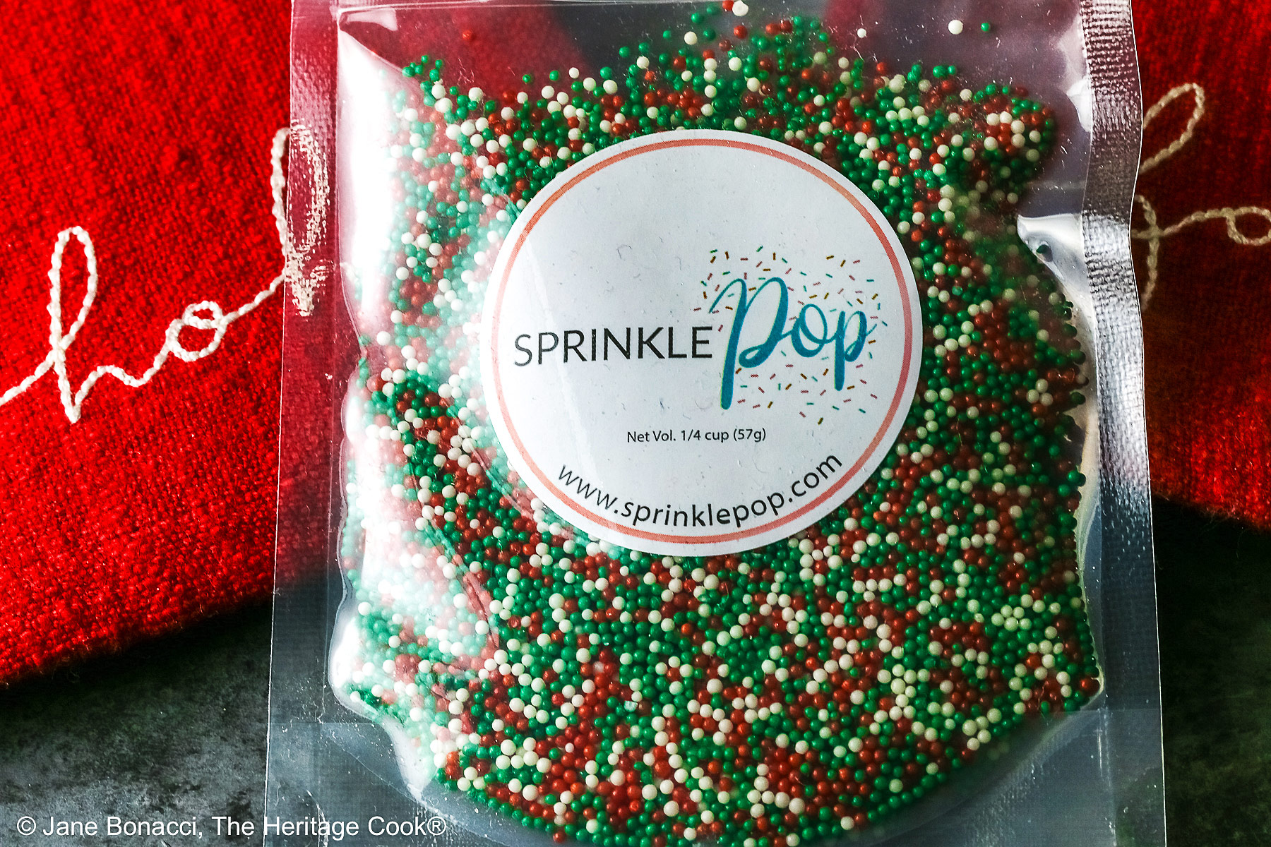 Package of Sprinkle Pop's red, green, and white sprinkles.