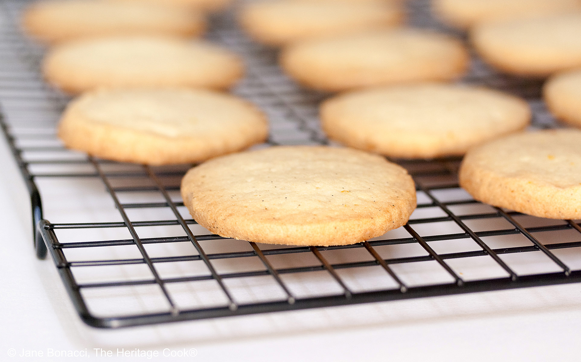 Hot cookies cooling on a wire rack, getting ready for dipping in chocolate!