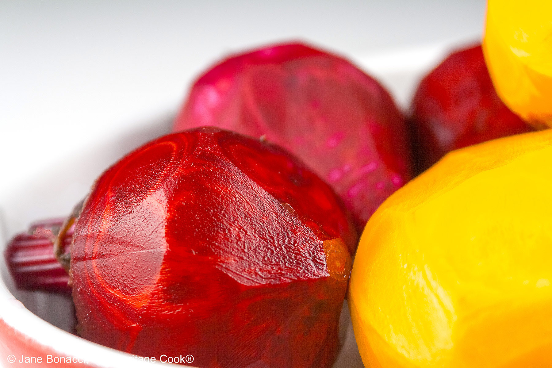 Close up of peeled red and golden beets.
