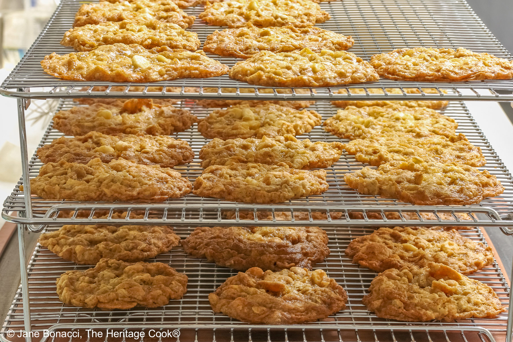 Cookies chilling on a 3-tier cooling rack.