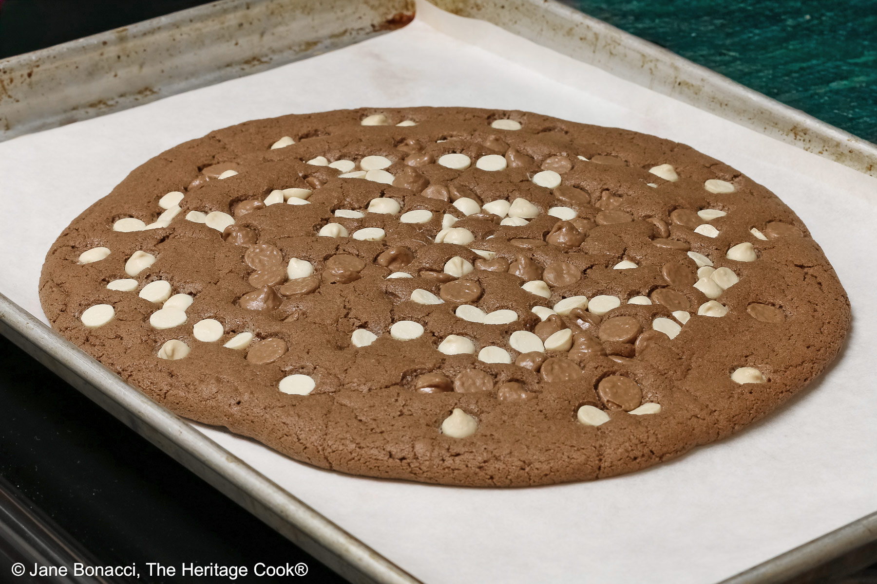 Hot from the oven, the cookie almost filled my half-sheet baking pan!