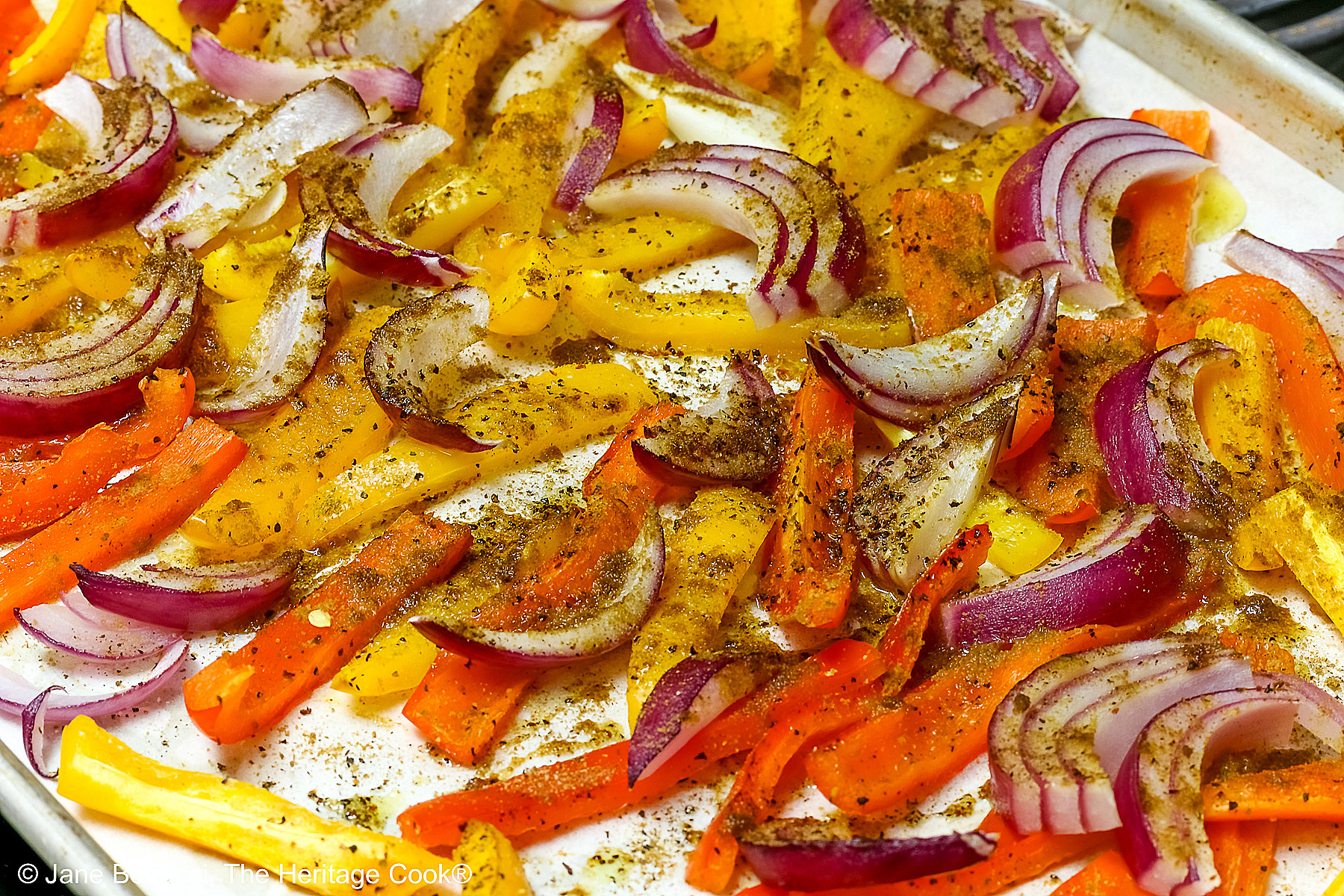 Pan of partially roasted vegetables.