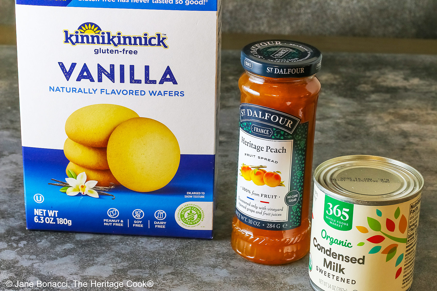 Ingredients for the Peach Cobbler Ice Cream, vanilla wafers, peach preserves, and sweetened condensed milk.