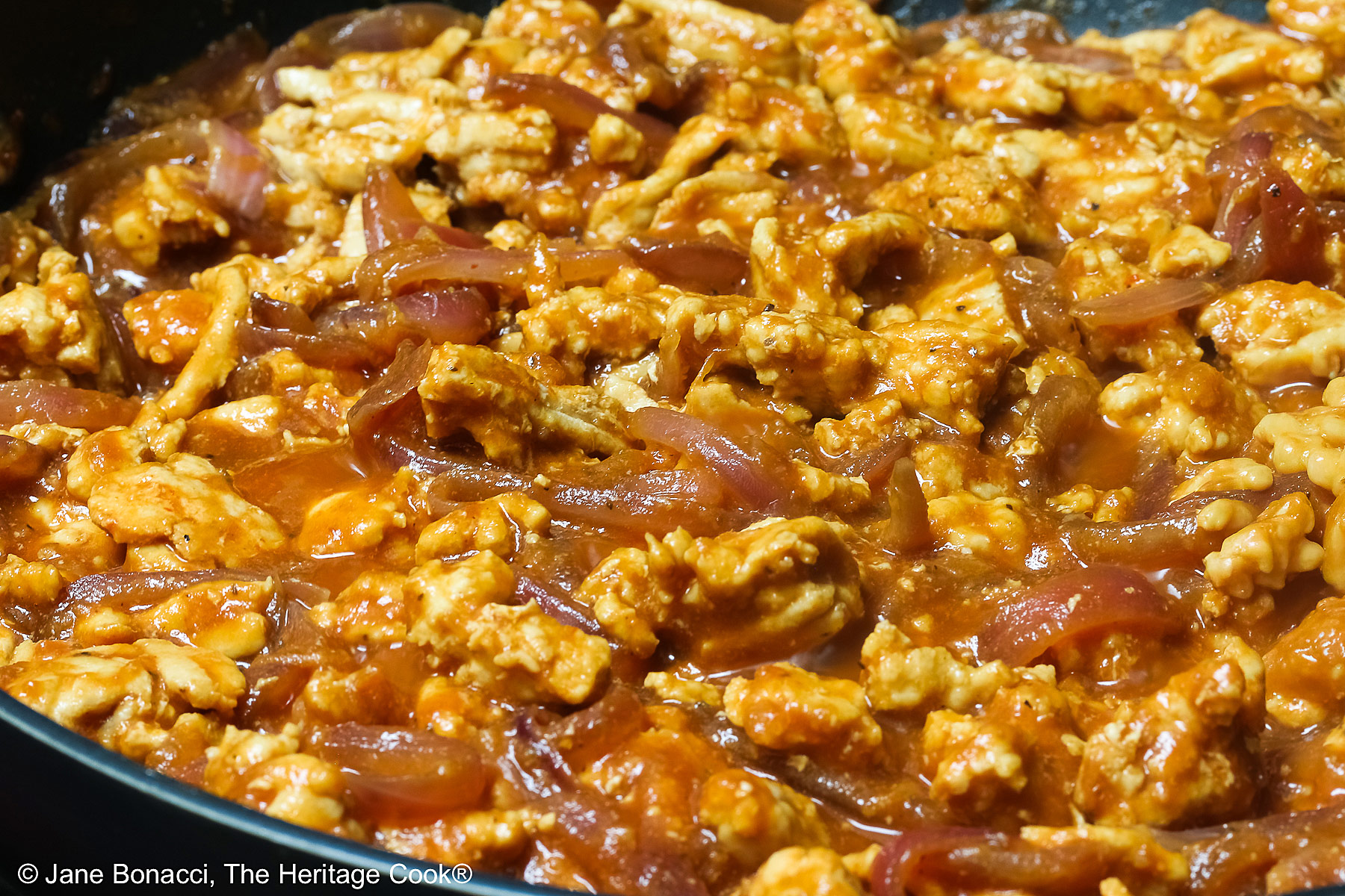 Cooking the Asian turkey sloppy joe filling in a large skillet.